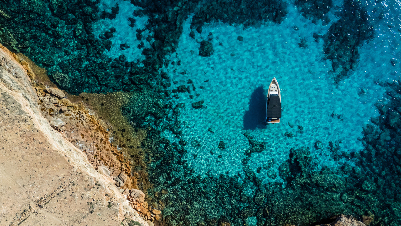 mega yacht anchored off the coast of Ibiza
